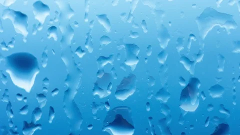 Time lapse rain drops on a window glass. Close up water texture. Loop movie Stock Footage 91596394