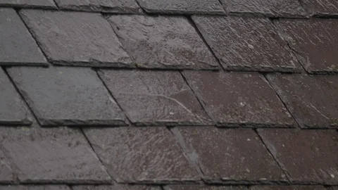 Time lapse of rain falling on slate roof Stock Footage 98745250