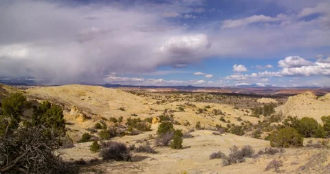 Time-Lapse of a rain squall approaching across  Escalante Monument Stock Footage 124449936