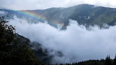 Time lapse -  rainbow and low clouds - Pozzale (BL) Italy - 4k Stock Footage 98750360