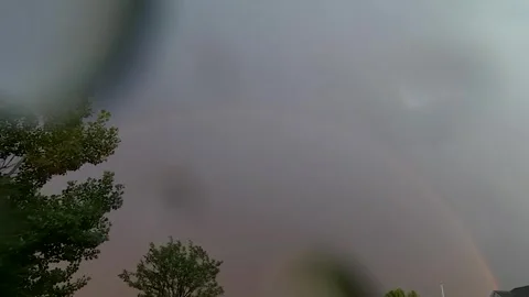 Time Lapse of a Rainbow Forming in the Rain 12 seconds Stock Footage 279856963