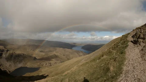 Time lapse of rainbow looking down towards Haweswater Reservoir Stock Footage 162671979