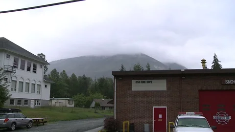 Time-lapse of rainstorm passing over Oso, WA Fire Department building. Stock Footage 86756621