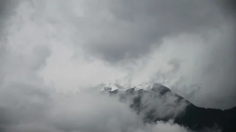 Time lapse of rainy clouds forming over the mountains Stock Footage 211877332
