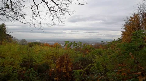 Time lapse of rainy clouds moving fast above green hills Video stock 43453643