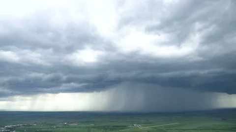 Time lapse of rainy clouds over the plain Stock Footage 108537799