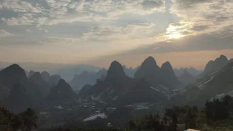 Time-lapse of Rapid Clouds Flowing Over Guilin Karst Mountains Stock Footage 329342153