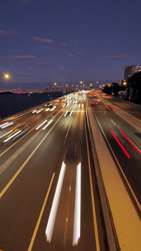 Time-lapse of rapid traffic flow on Olympic-daero at nightfall, vertical shot Stock Footage 295024903