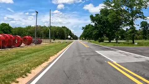 Time-lapse Rear car POV country and puffy clouds and blue sky Stock Footage 185207627