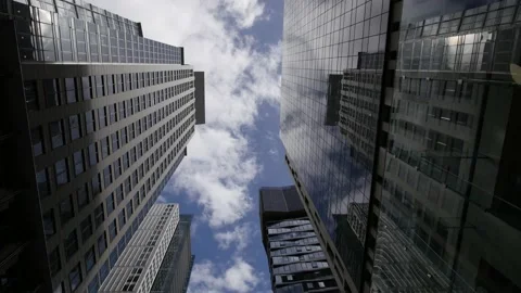 Time lapse reflected Skyscraper and clouds  4K Stock Footage 144719463