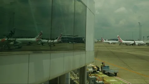 Time lapse reflected Virgin Air planes at Brisbane airport 4K Stock Footage 329343285