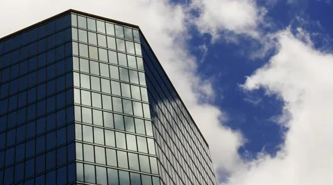 Time-lapse of a reflective building with fast cloud movement Stock Footage 49277659
