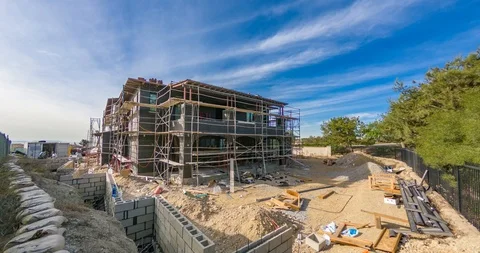 Time lapse of a residential construction site. Workers building a house. Stock Footage 85651570