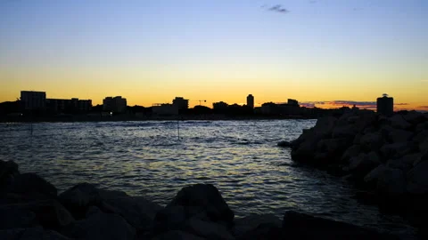 Time lapse of rimini beach at sunset with waves Stock Footage 135513958