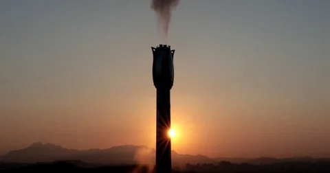Time lapse of rising sun behind chimney of factory :4K Footage Stock Footage 73241231