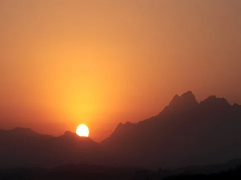 Time lapse of rising sun over mountain : 4K footage Stock Footage 74432927