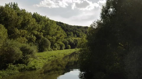 Time lapse of river flow through the trees on banks Stock Footage 46083984