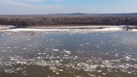Time lapse of a river flowing during cold winter with ice flowing Stock Footage 111668745