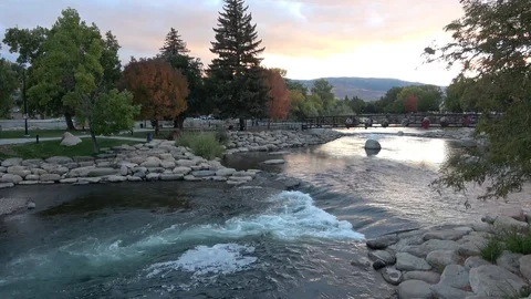 Time lapse of river at sunset with people in park in Reno Stock Footage 96731007