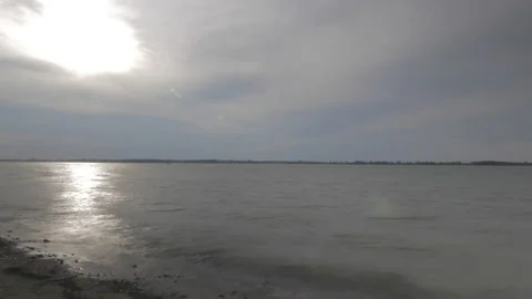 Time lapse of river, waves, beach, sun Stock Footage 169285636