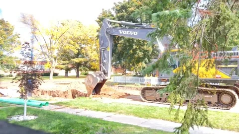 Time lapse of road construction back hoe Stock Footage 230020506