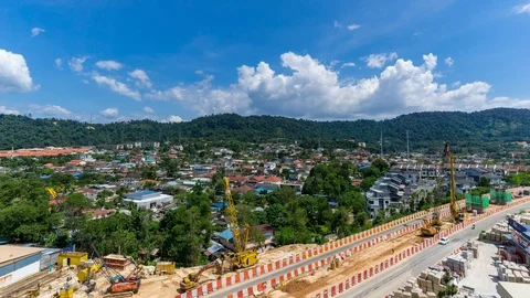 Time lapse of road construction over moving clouds Stock Footage 87024595