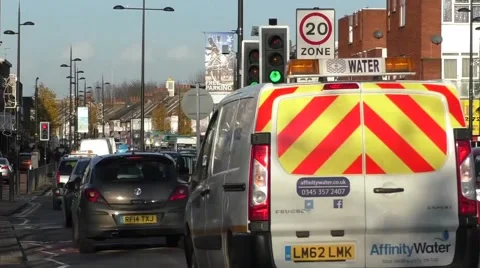 Time lapse road traffic passing and stopping at traffic lights Stock Footage 45550020