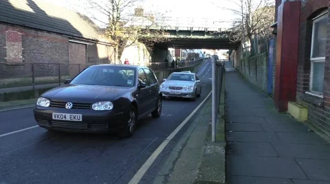 Time lapse road traffic on underpass and people walking on footpath Stock Footage 45550350