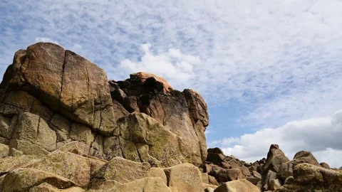 Time Lapse of rocks against clouds moving in Sillon of Tallbert Stock Footage 94844415