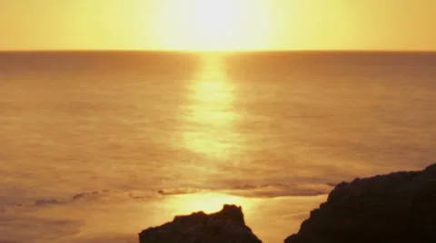 Time lapse of rocky coast while sun sets. Cropped. Stock Footage 54172732