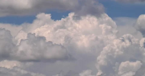 Time lapse of roiling, cumulonimbus clouds building on hot summer afternoon Stock Footage 152523878