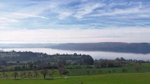 Time Lapse Of Rolling Clouds On Blue Sky Over Green Field Background Video Stock Footage 267892097