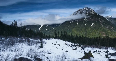 Time lapse of rolling clouds over mountain peak in Mt Baker Snoqualmie National  Stock Footage 99268676