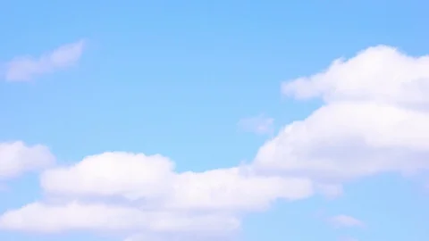 Time lapse, rolling puffy clouds are moving across summer blue sky. 4k Timelapse Stock Footage 115656452