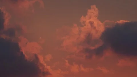 Time lapse of rolling puffy sunset clouds are moving Stock Footage 276965574