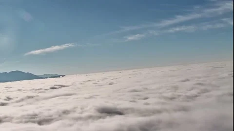 Time-lapse of rolling sea of clouds flowing like ocean waves Stock Footage 330142284
