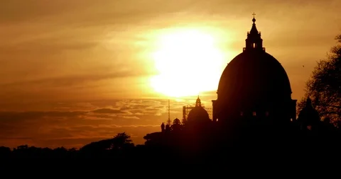 Time Lapse Roma Dramatic Sunset behind the silhouette of the dome of St. Peter Stock Footage 104965591