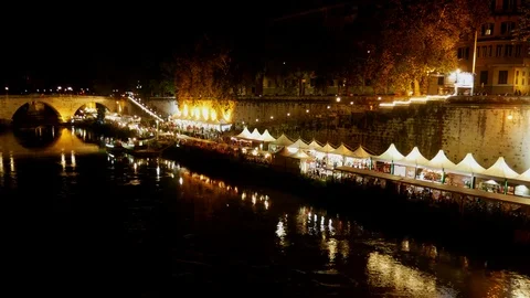 Time lapse Rome by night at Summer - Many people walking on quays near the river Stock Footage 91961250