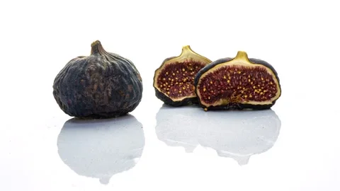 Time lapse of rotting figs on white background, educational video, life and Stock Footage 213510755