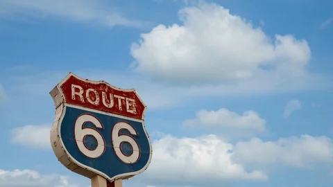 Time lapse of route 66 road sign and blue sky Stock Footage 75365328