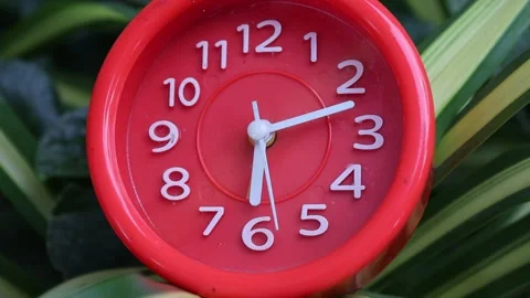 Time lapse running, alarm clock red plastic case white pointer Stock Footage 139903555