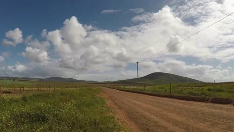 Time lapse of a rural dirt road Stock Footage