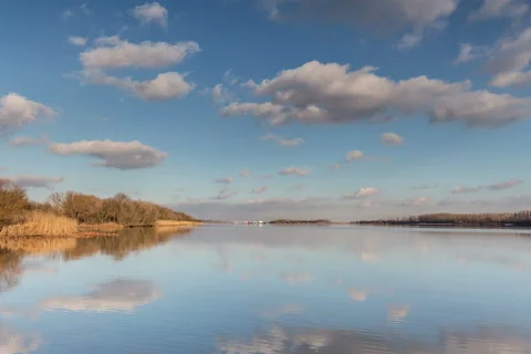 Time lapse. Russia. Moving clouds and their reflection in the river Don. Stock Footage 60055846