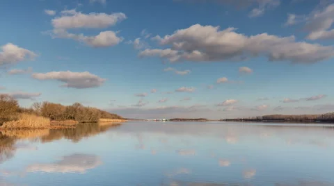Time lapse. Russia. Moving clouds and their reflection in the river Don Stock Footage 60056018
