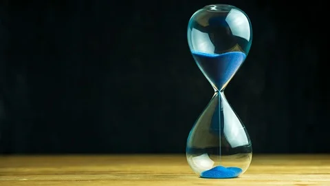 Time lapse sand clock on wooden table and black background. Stock Footage 109141825