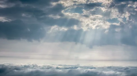 Time-lapse scene of cloudy sky with ray of sun light over city Stock Footage 39068646