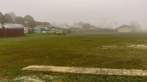 Time lapse of school students doing sports activity during foggy morning Stock Footage 86010934