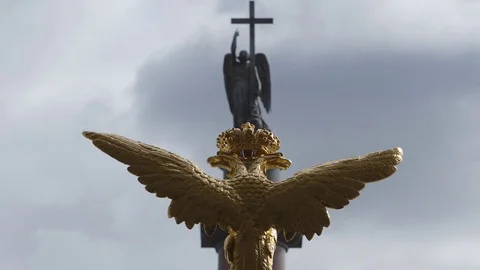 Time-Lapse of the sculpture of golden two-headed eagle and the angel Stock Footage 80754627