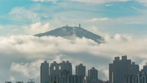 Time lapse of sea of clouds with mountain Tai Mo Shan in Hong Kong city Stock Footage 244931528