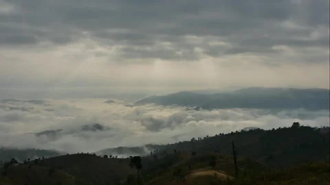 Time-lapse of the sea of clouds surrounding the mountain Stock Footage 263005320